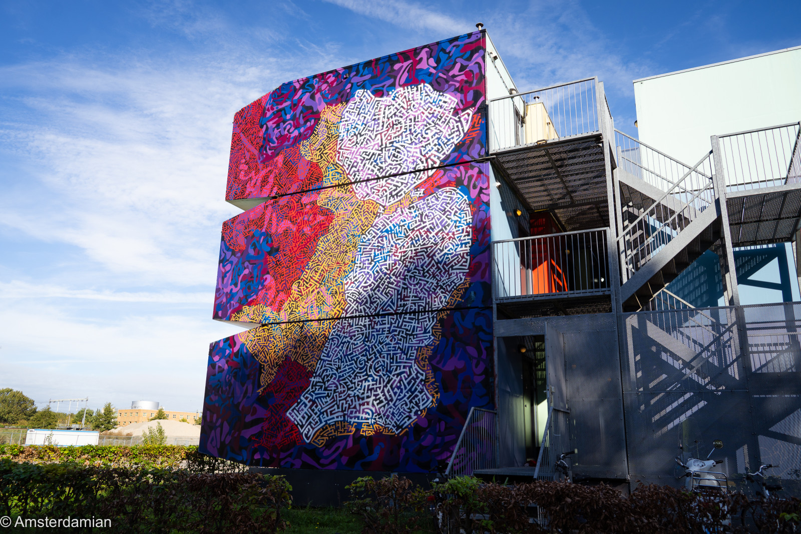 Building covered in a colourful patterned mural in Almere