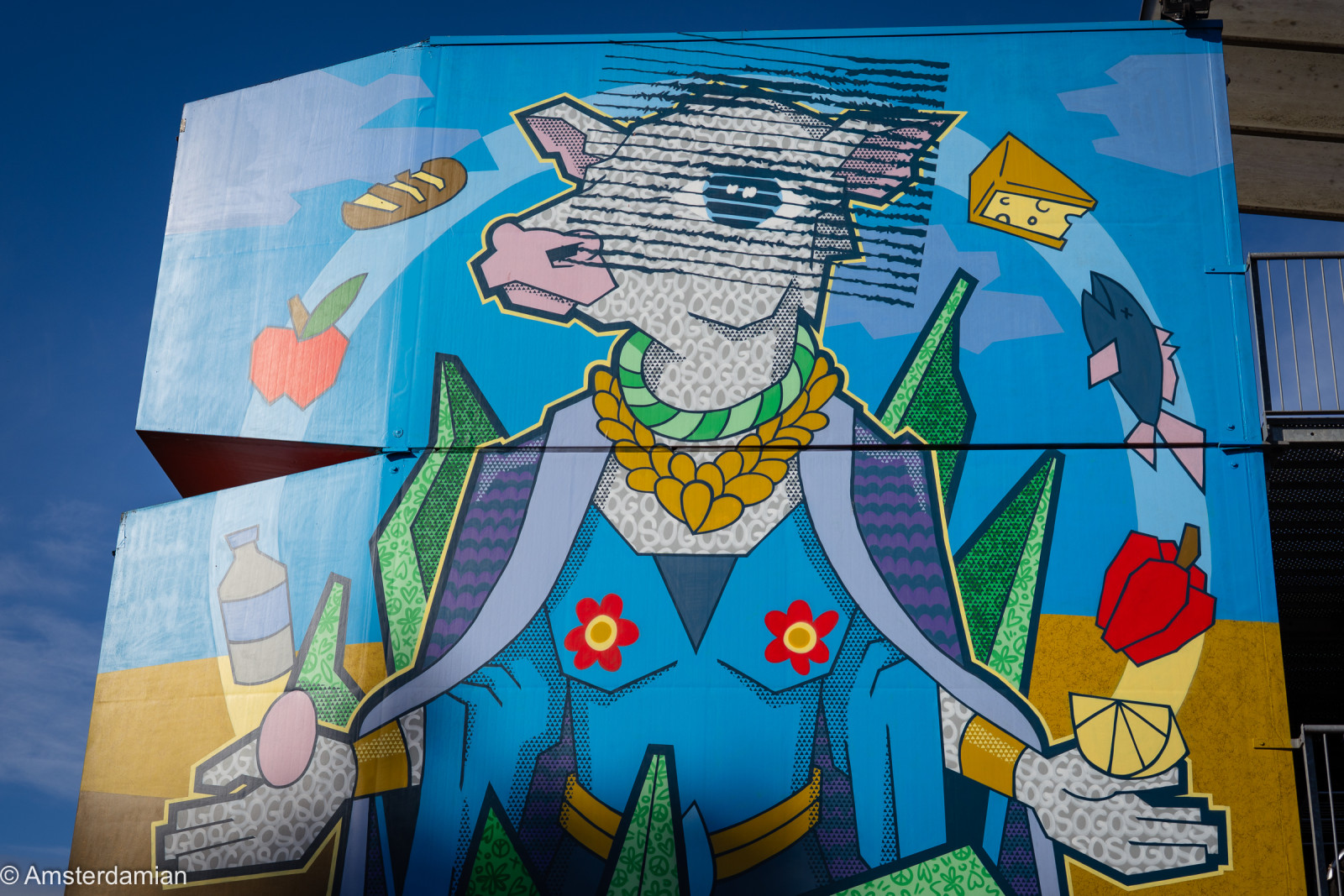 Colourful Almere mural of a cow in a blue suit, with bread and cheese