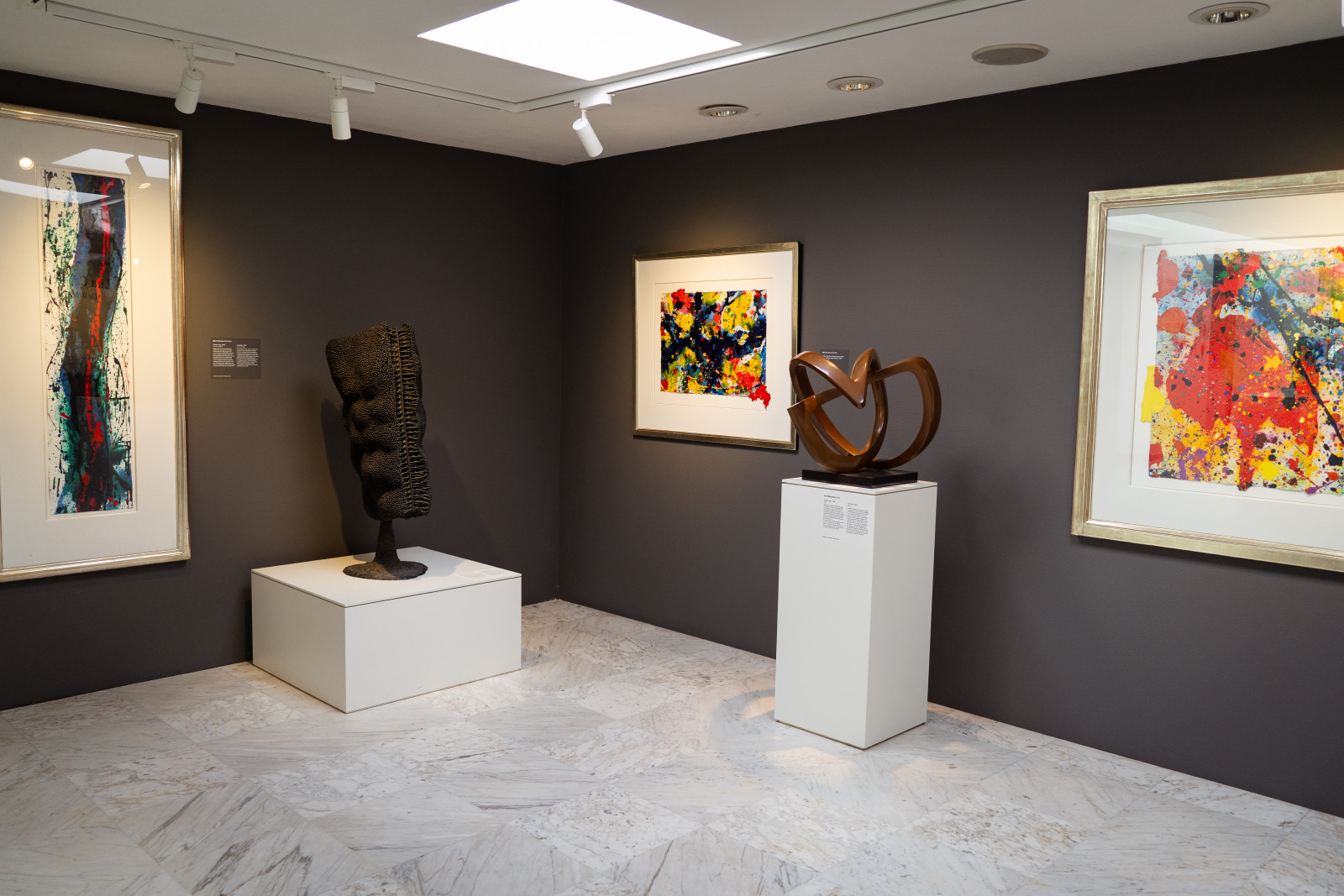 Gallery with colourful abstract paintings and sculptures at Museum JAN