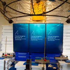Interactive fishing exhibit with rods and screens at the new ARTIS Aquarium
