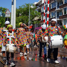 Young drummers in colourful koto dresses at the Bigi Spikri parade, Amsterdam