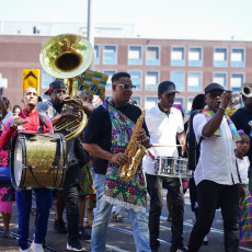 Brass band marching in the Bigi Spikri parade, Amsterdam, on Keti Koti
