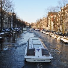 Cruising on the frozen canals Amsterdam
