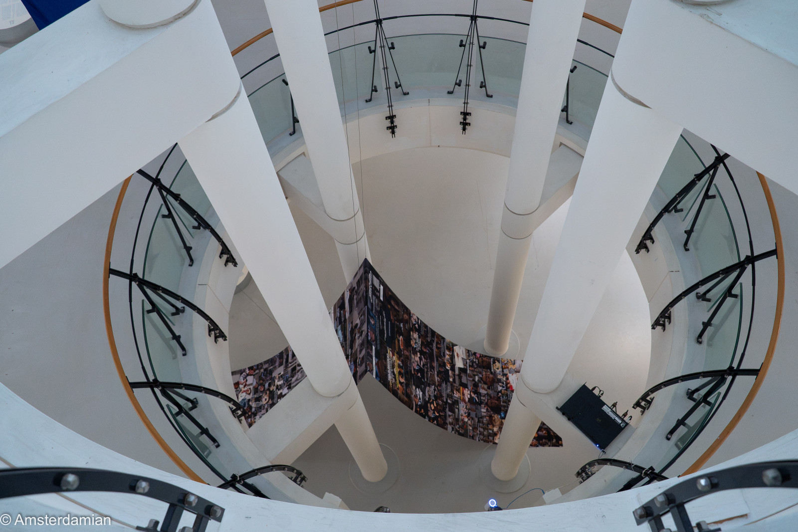 View down the round atrium of Fotomuseum Hilversum to a collage wall