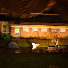 A lit whale-hunting scene installed in a canal, a nod to De Rijp's whaling past
