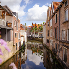 Canal between old brick houses in Oudewater