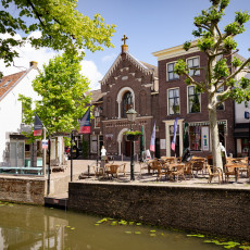 Café terraces by a canal in Oudewater