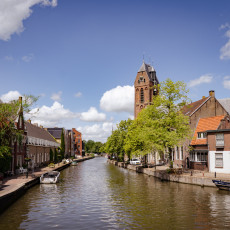 River view with a church tower in Oudewater