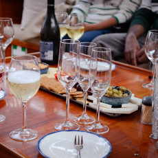 Wine and snacks on board a canal boat in Amsterdam