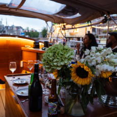 Warm lighting inside the boat on an evening canal cruise in Amsterdam