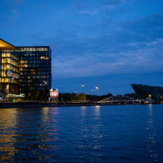 Amsterdam public library and NEMO at night, seen from the water