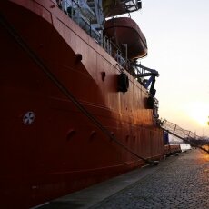 Red ship and the sun setting