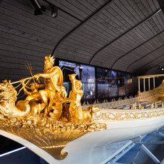 The Royal Barge with its Neptune carvings on display at Het Scheepvaartmuseum