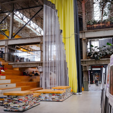 Stepped seating and hanging curtains inside the LocHal, Tilburg