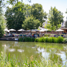 Villa la Vida waterside terrace seen across a pond