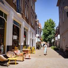 Shops and terraces on a narrow street in Tilburg