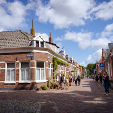 Street corner with shops and passers-by in Veere
