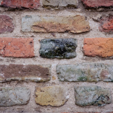 Close-up of a weathered brick wall in Veere