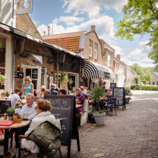 Cafe terrace on a sunny street in Veere