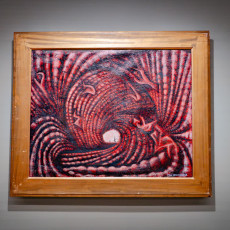 An early Kusama painting in red and pink, full of swirling wave-like forms