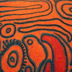 Detail of a Kusama painting, orange ground covered with looping lines of dots