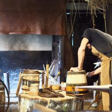 Cooper shaping a wooden barrel in the workshop at the Zuiderzeemuseum, Enkhuizen