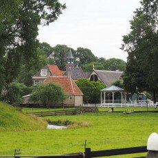 Church tower and bandstand across the meadow in the Zuiderzeemuseum open-air village