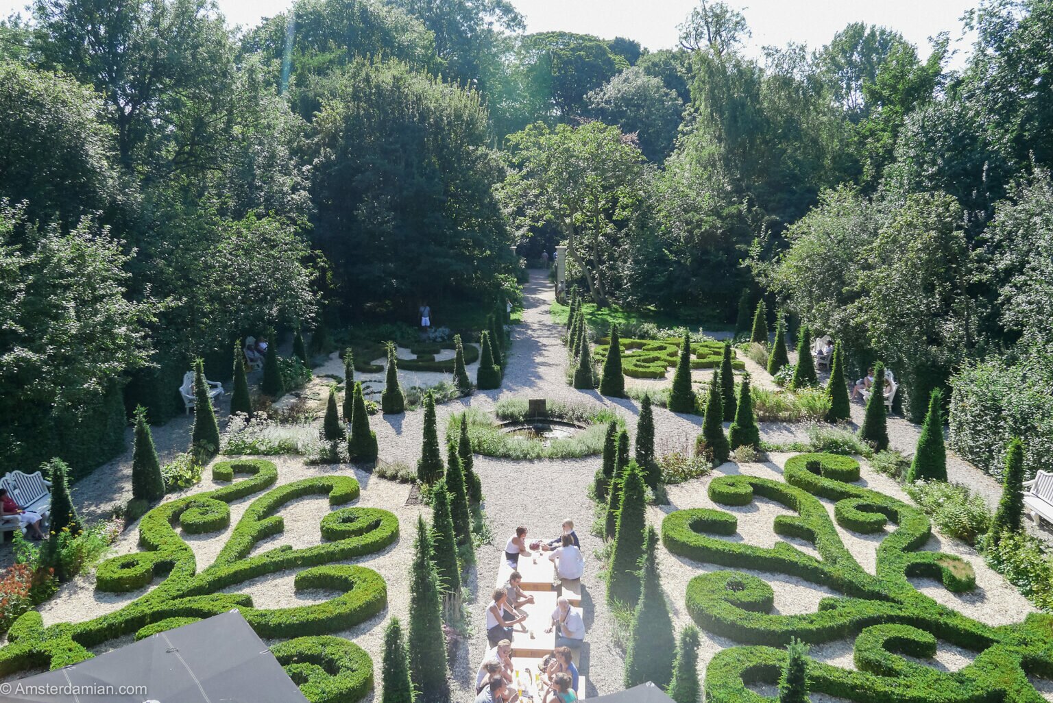 Museum Van Loon garden with symmetrical hedges and pond