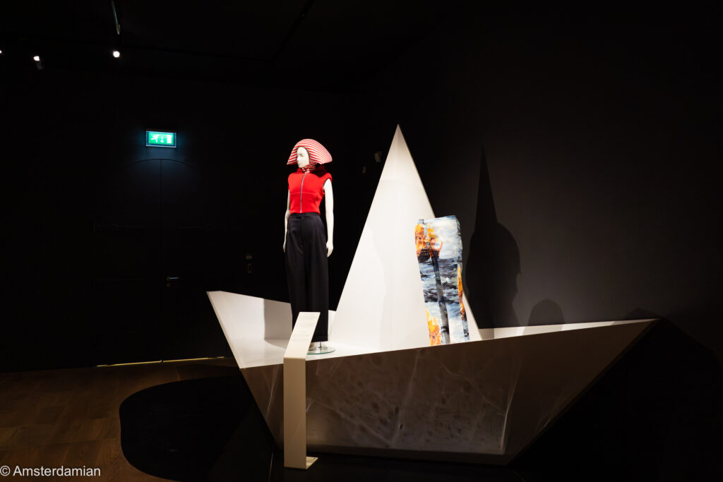 Woman in red in a boat. Oceanista exhibition Amsterdam