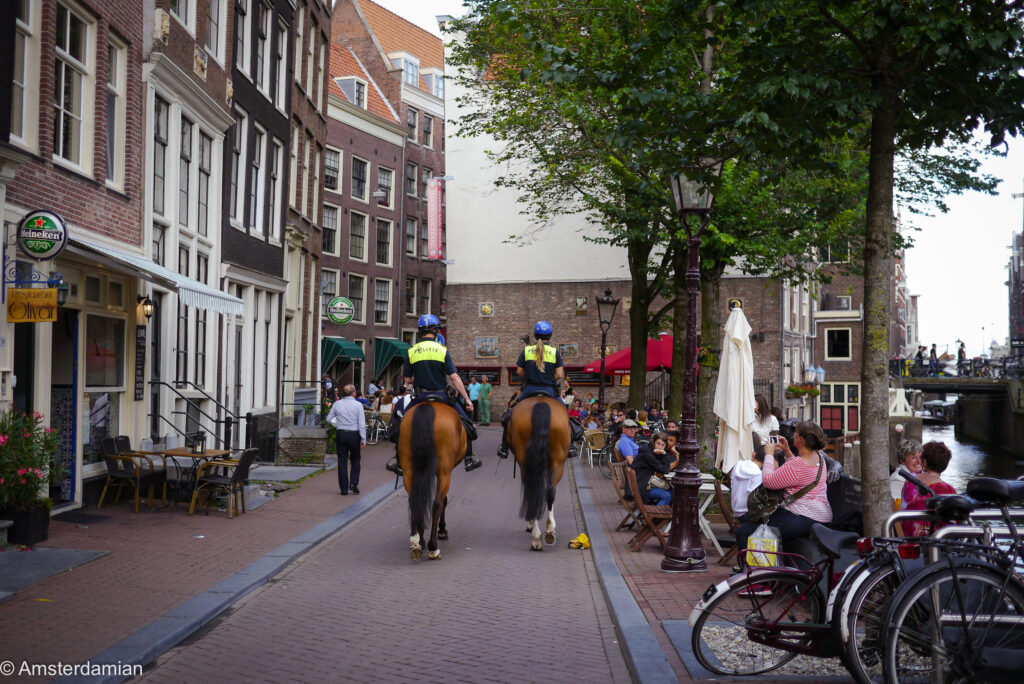 Police on horses in the Red Light District Amsterdam