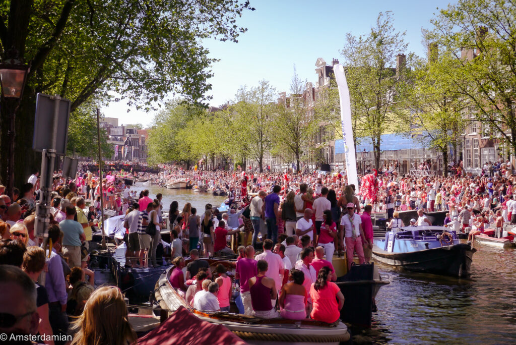 Packed canal banks and boats in the sunshine during the 2013 Canal Parade