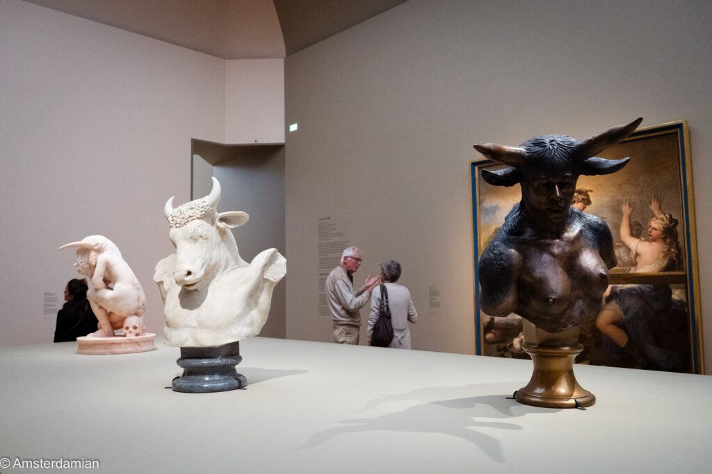White marble bull bust and bronze female minotaur displayed together at the Rijksmuseum