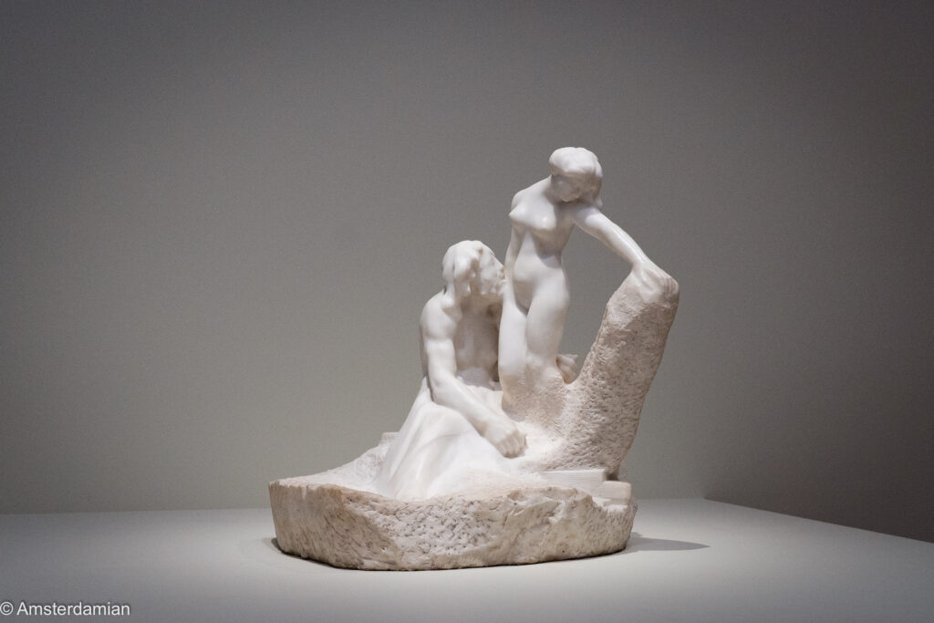 Rodin's marble sculpture of Galatea emerging from rough stone before a kneeling Pygmalion