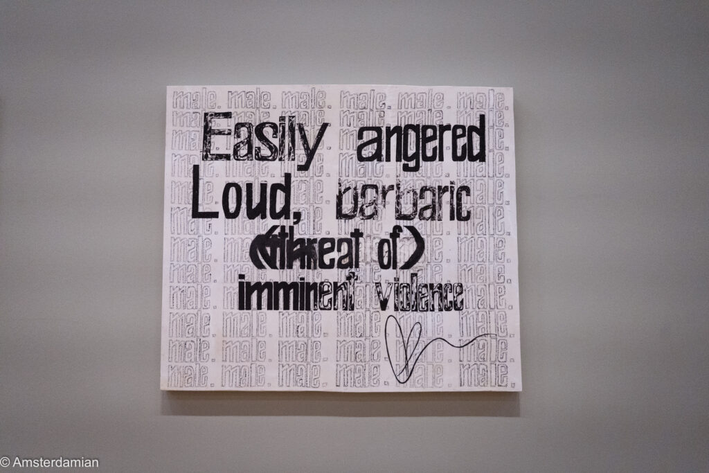 Text painting reading easily angered, loud, barbaric, threat of imminent violence