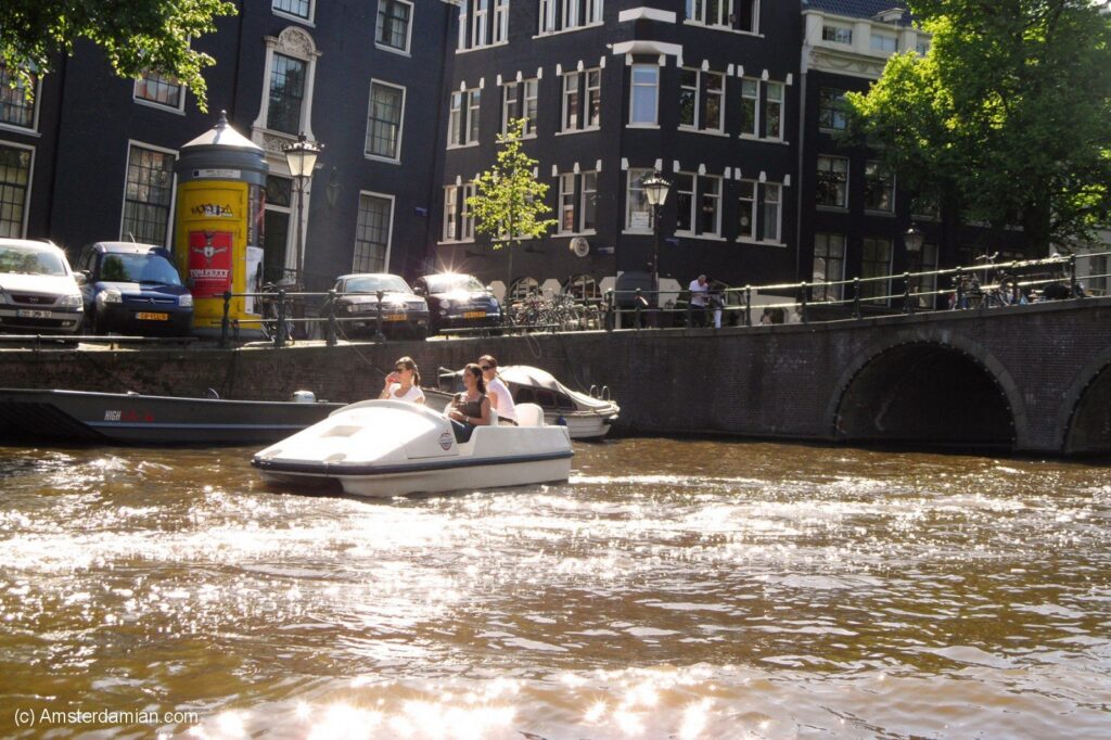 People on a pedal boat in Amsterdam