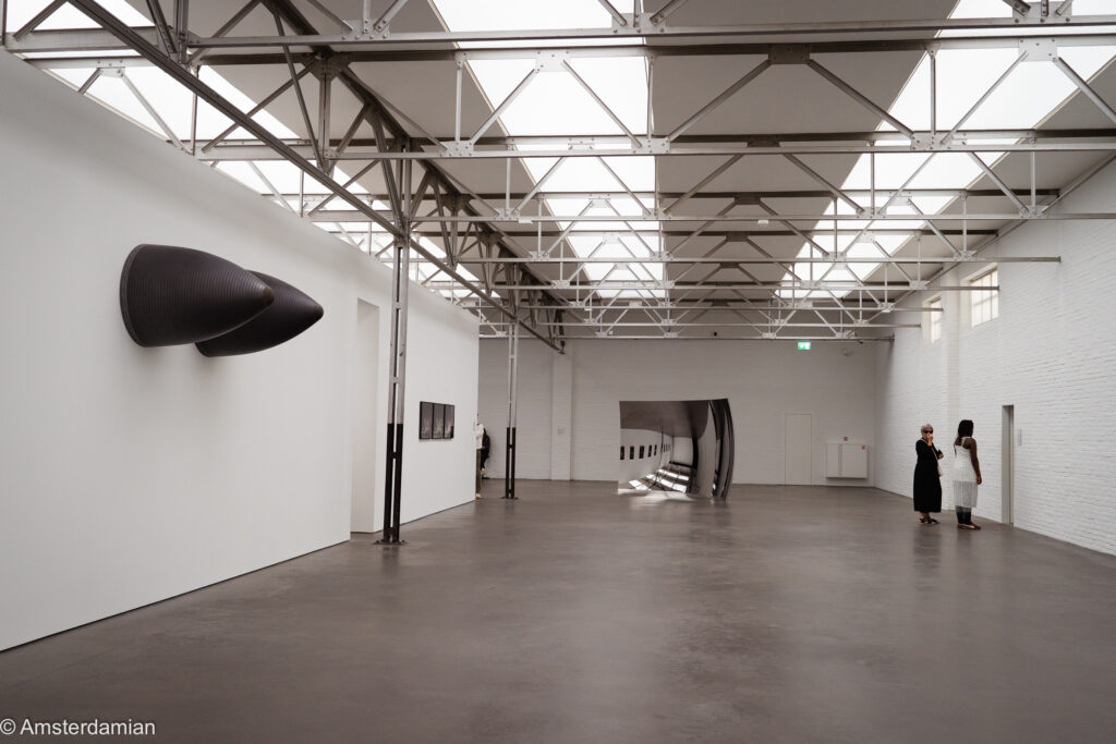 Main hall at De Pont museum in Tilburg, white walls and daylight from the sawtooth roof