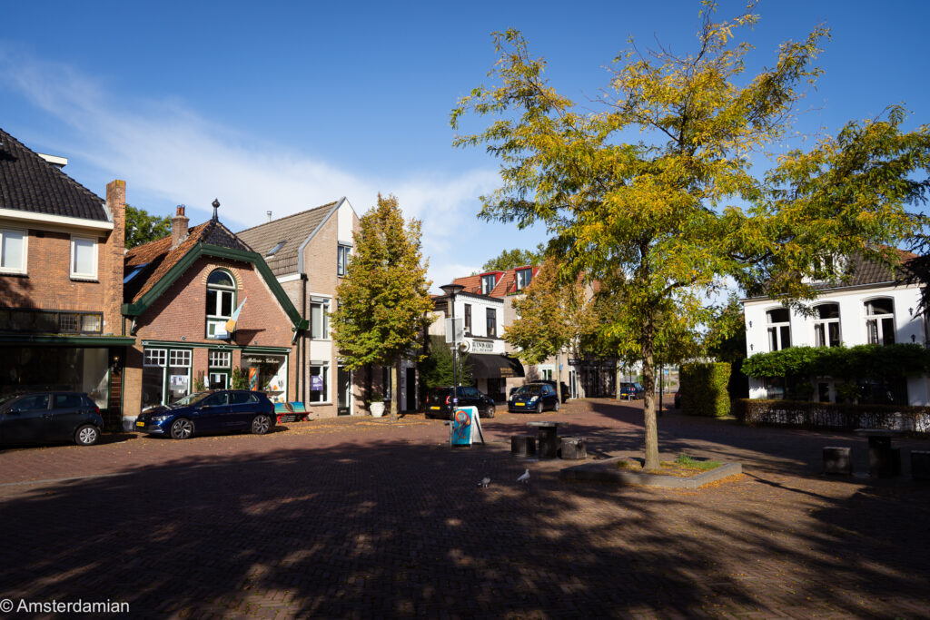 Village square with autumn trees and old houses in Amstelveen's Oude Dorp